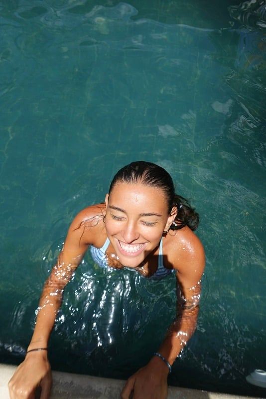 Smiling woman in the pool at The Baya House